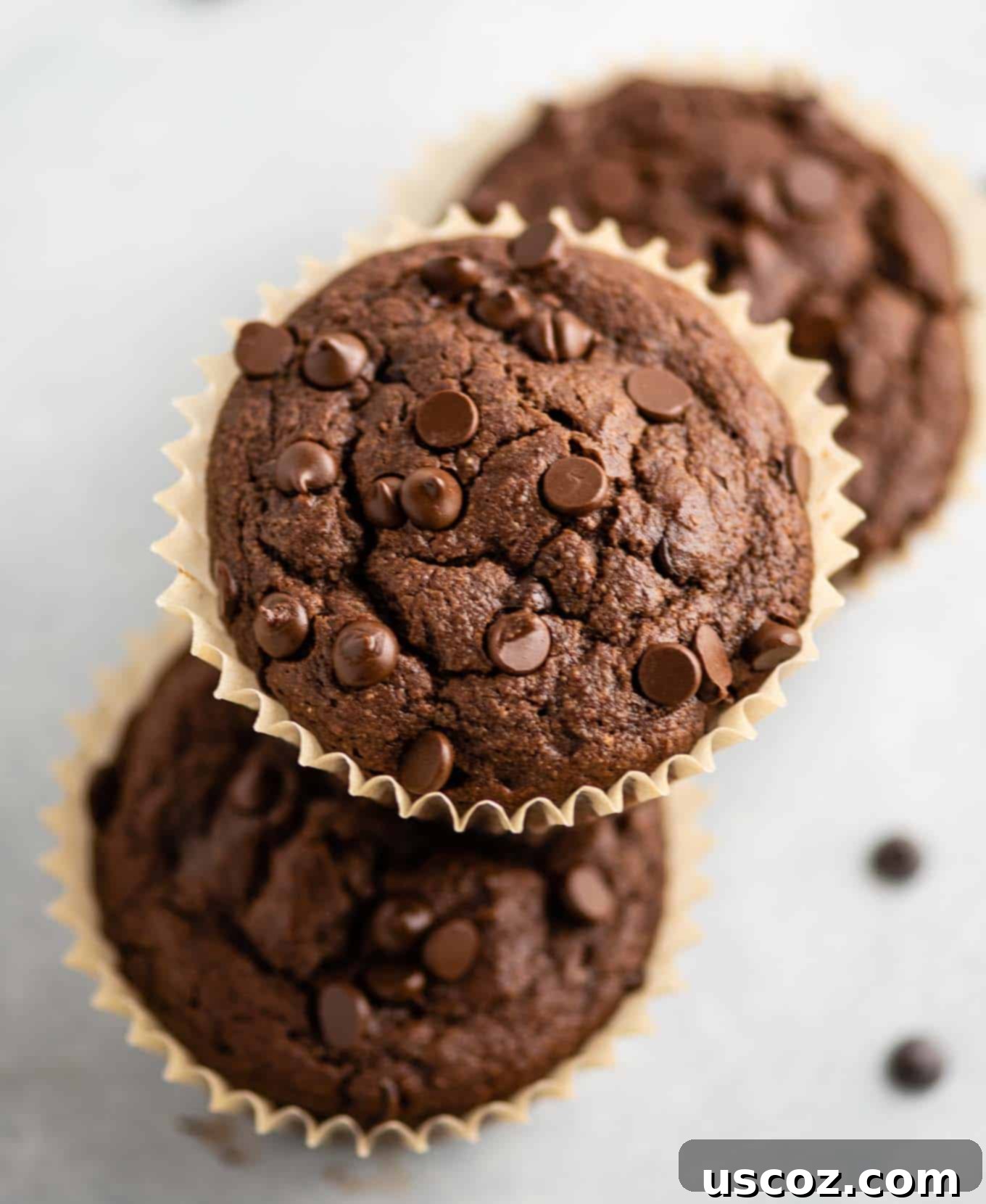 Irresistible Gluten-Free Chocolate Muffins 7 one chocolate muffin stacked on two other muffins