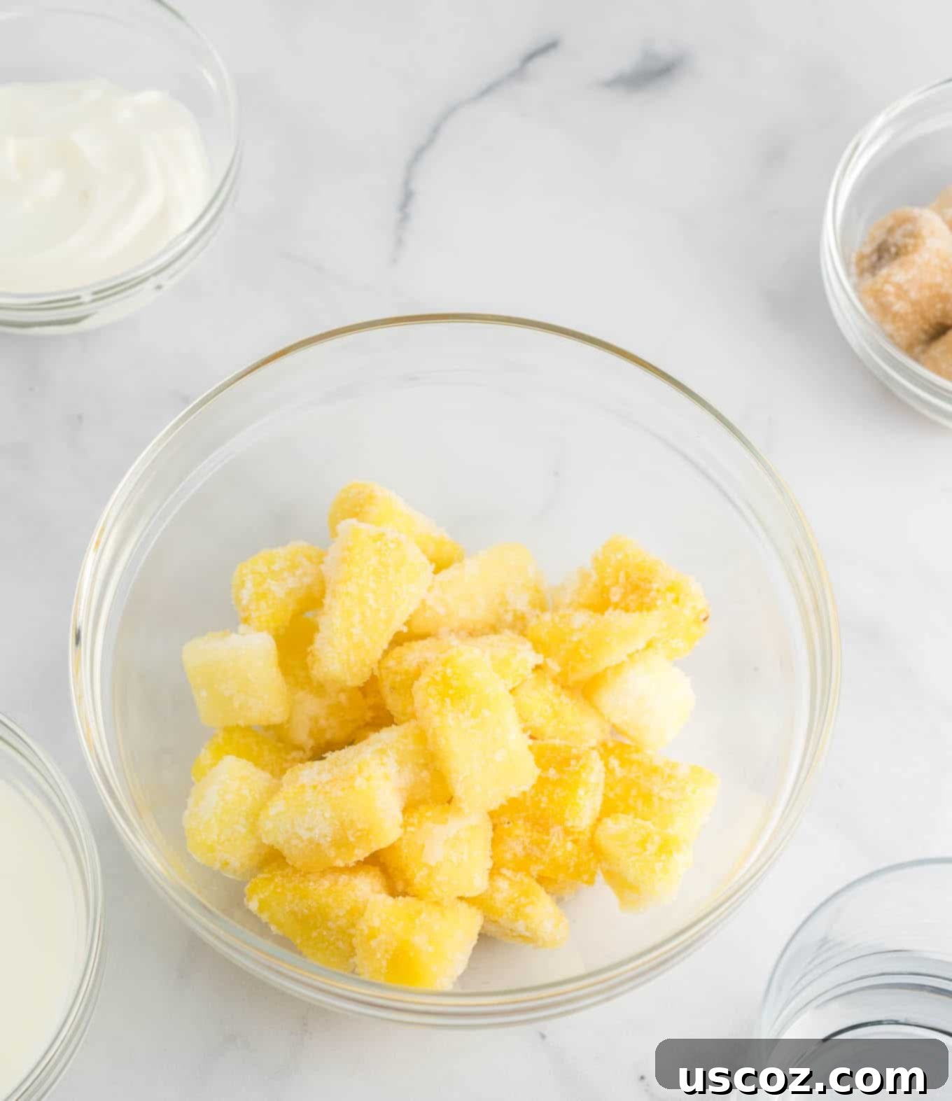 Tropical Pineapple Chill 4 frozen pineapple chunks in a clear glass bowl