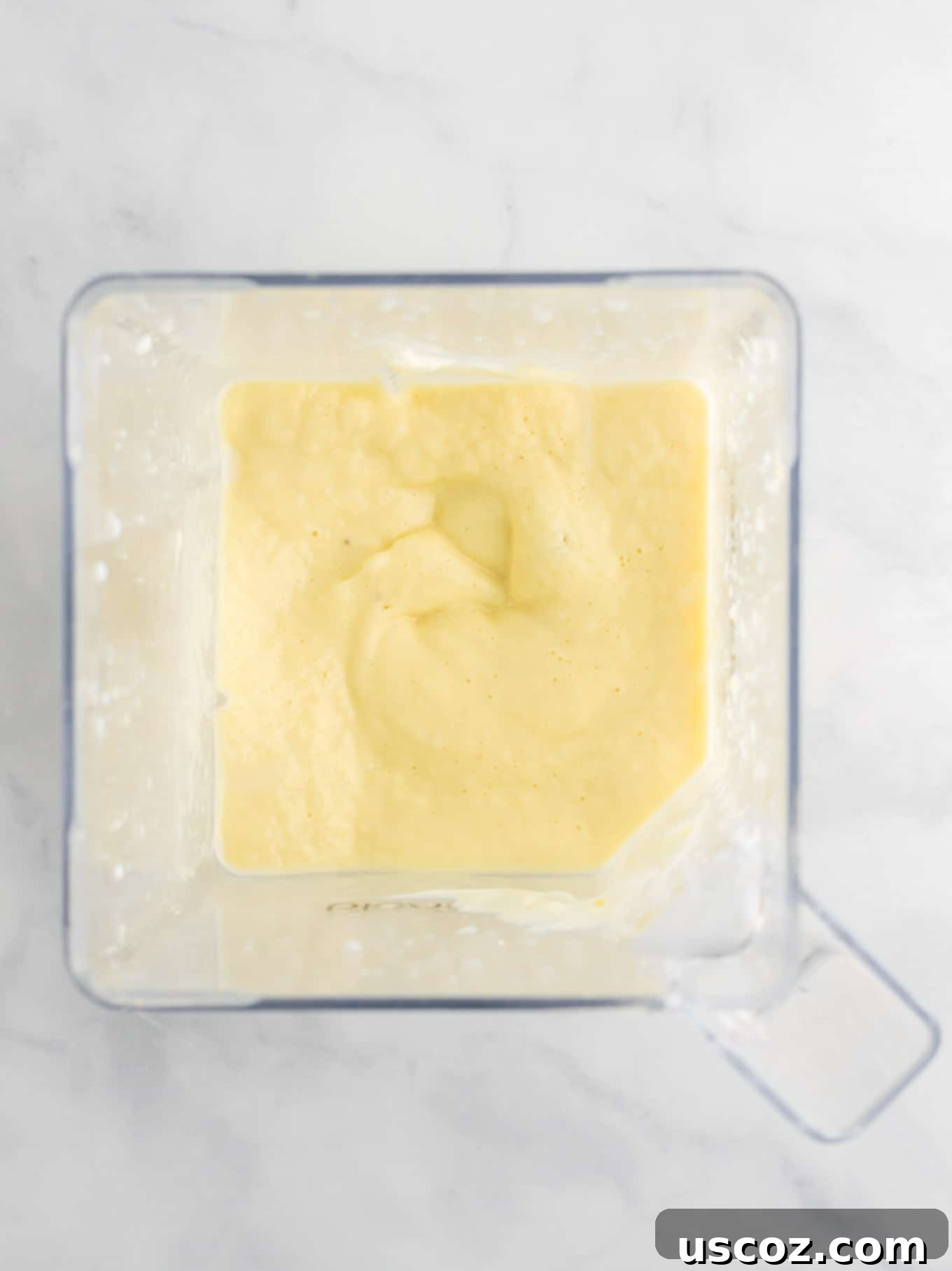 Tropical Pineapple Chill 7 smoothie in a blender from an overhead view