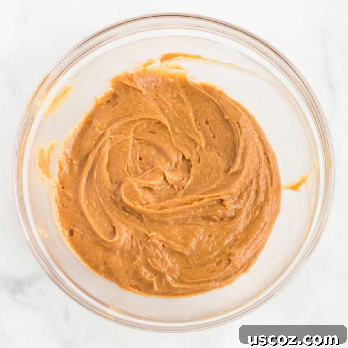 Irresistible Gluten-Free Peanut Butter Cookies 5 The smooth, uniform peanut butter cookie dough after all ingredients have been thoroughly mixed in a bowl, showcasing its ready-to-roll consistency.
