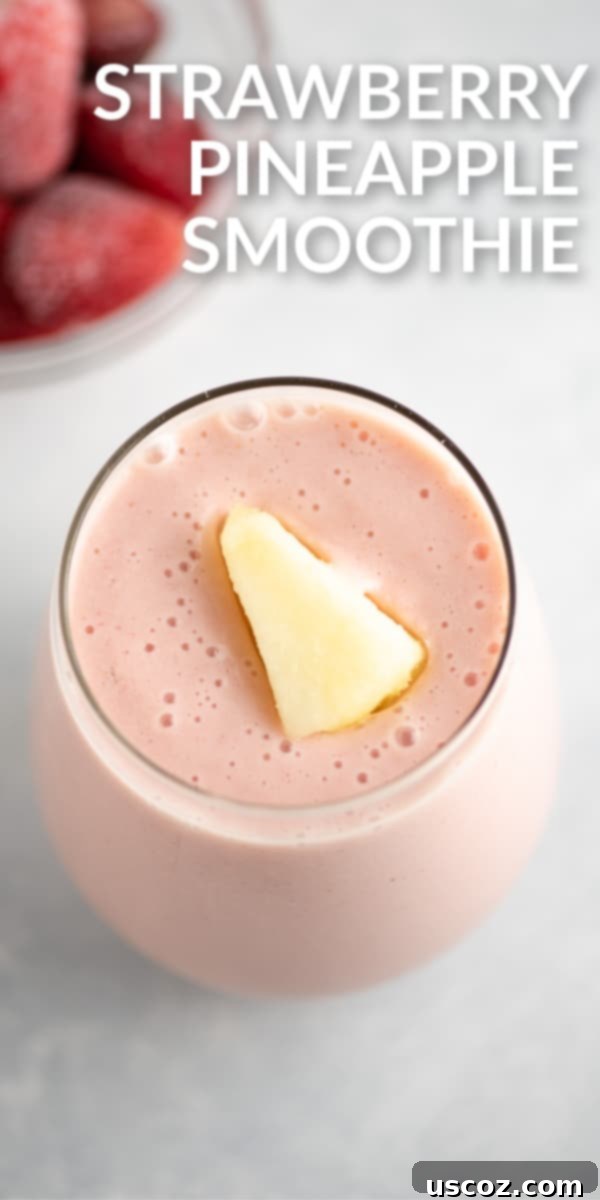 Pinterest graphic featuring the text "Strawberry Pineapple Smoothie" alongside a beautifully blended glass of the smoothie, perfect for sharing and saving.
