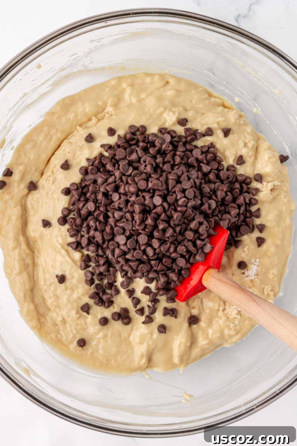 Moist Greek Yogurt Chocolate Chip Muffins 12 adding the chocolate chips to the batter