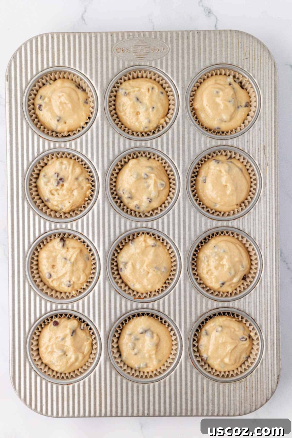 Moist Greek Yogurt Chocolate Chip Muffins 14 batter in a muffin tin