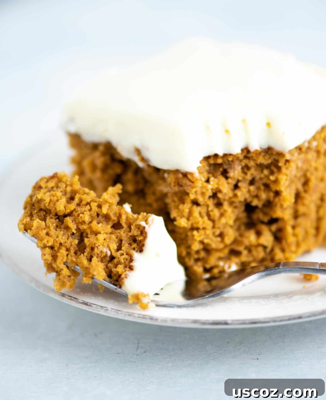 Decadent Pumpkin Cake with Cream Cheese Frosting 3 a bite of pumpkin cake with frosting