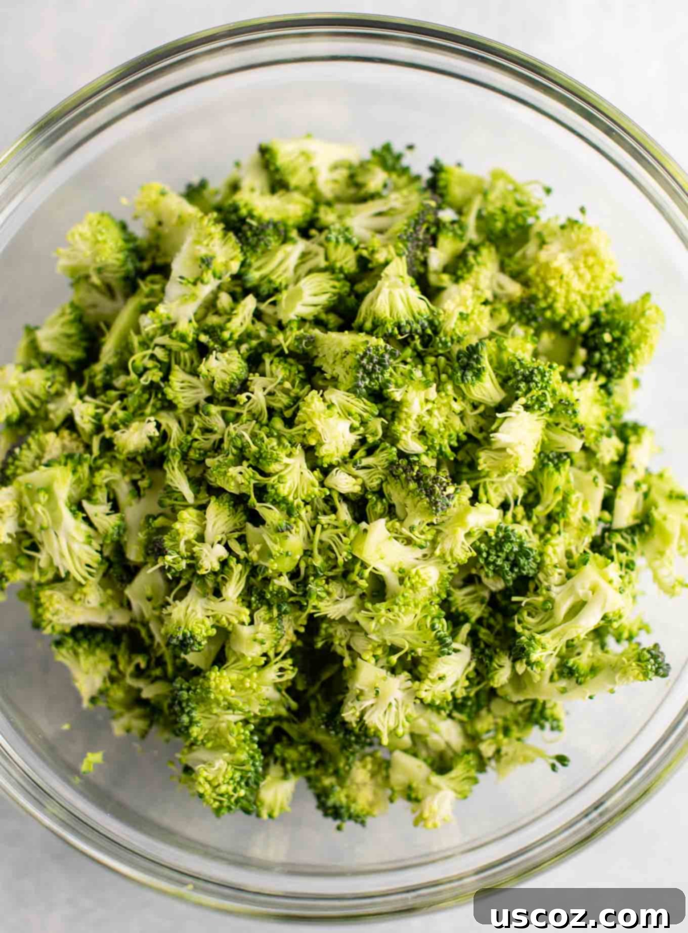 Velvety Broccoli Cheddar Soup 6 chopped up fresh broccoli in a clear bowl