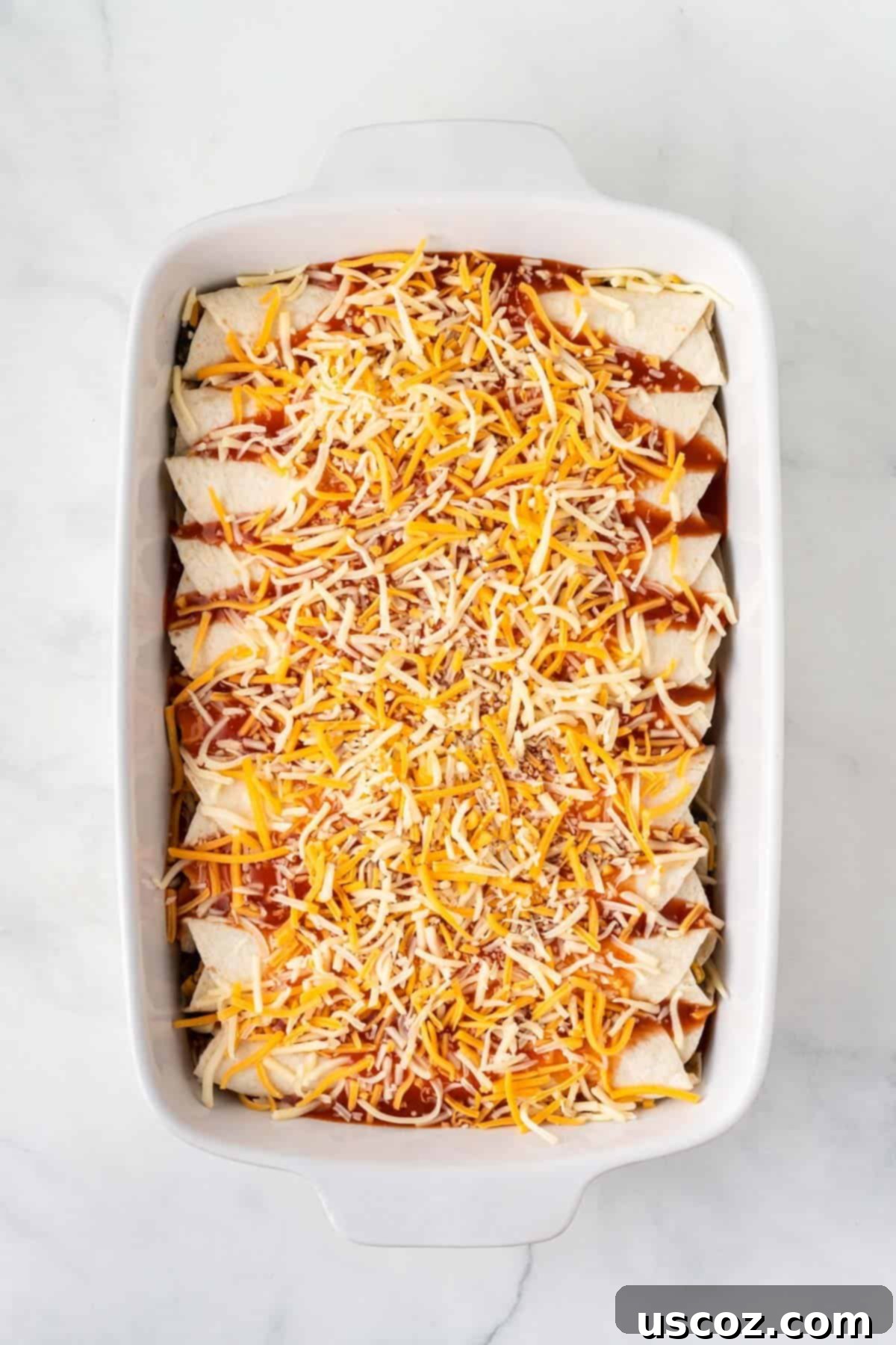 Irresistible Vegetarian Enchiladas 14 adding the mexican cheese on top