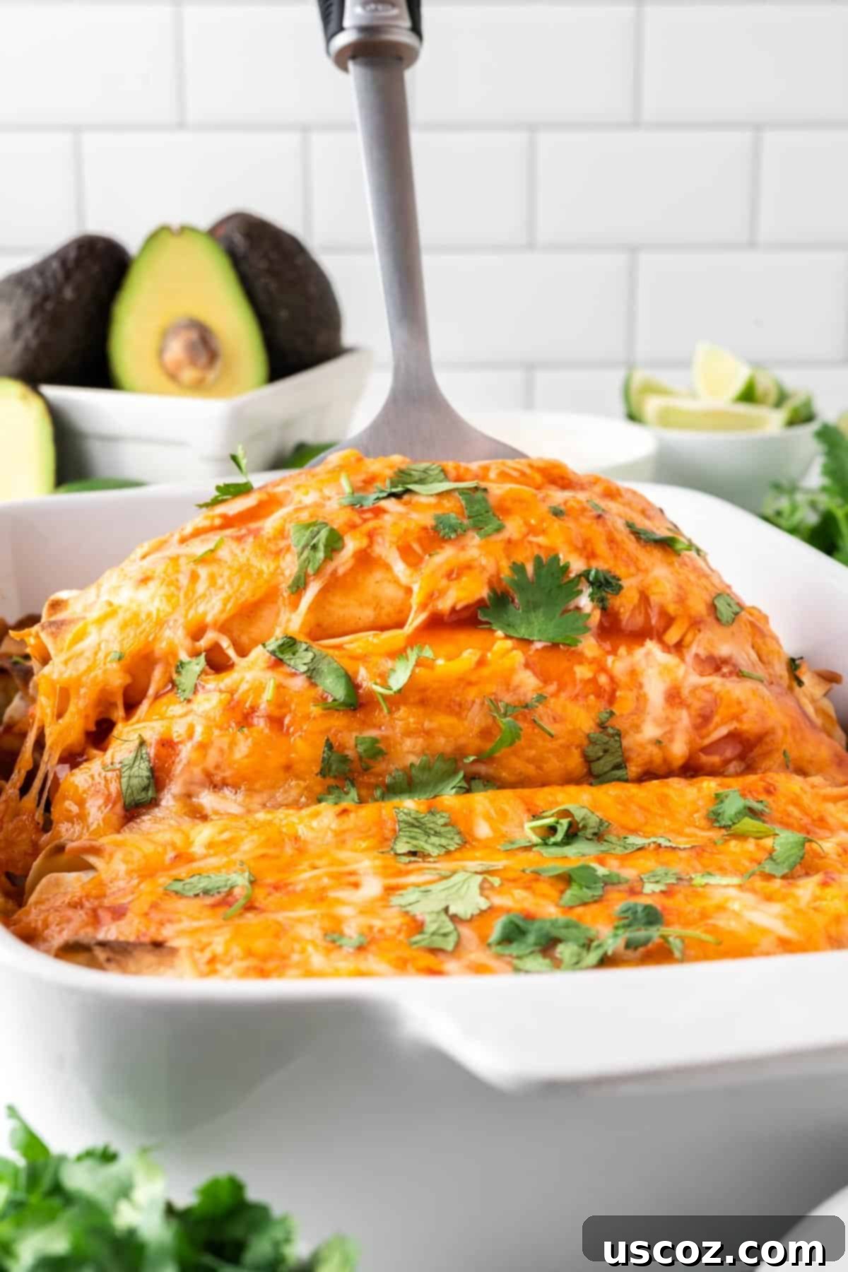 Irresistible Vegetarian Enchiladas 16 scooping enchiladas from the pan