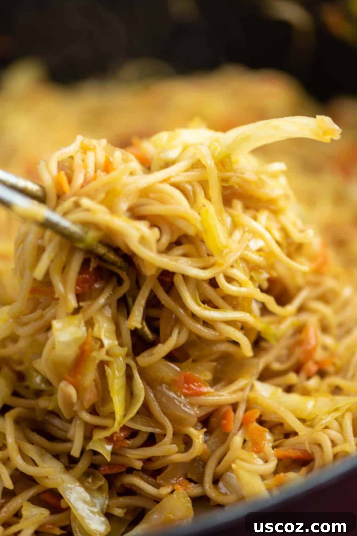Savory Cabbage Stir Fry 2 ramen noodles, cabbage, and carrots in a dish, ready to be served