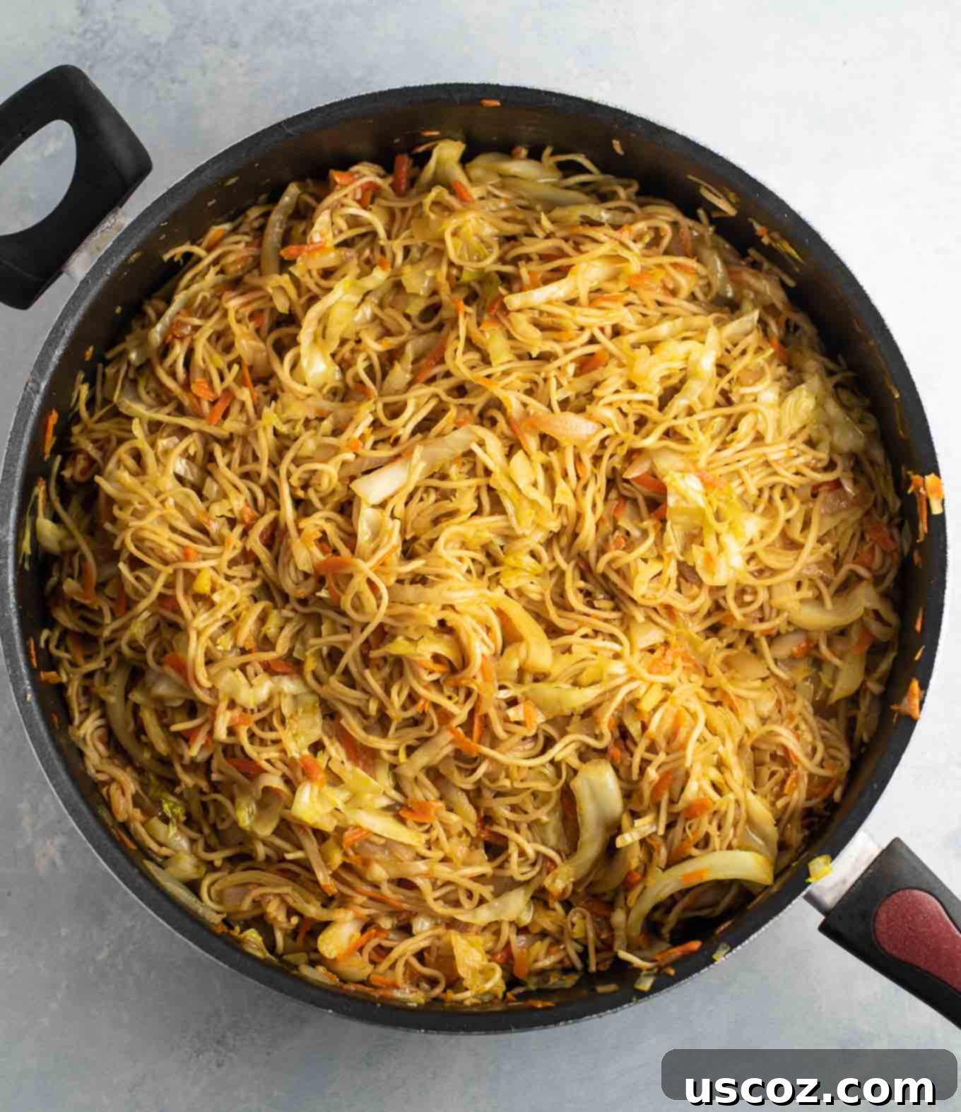 Savory Cabbage Stir Fry 13 overhead view of a skillet full of cooked cabbage stir fry noodles, ready to be served