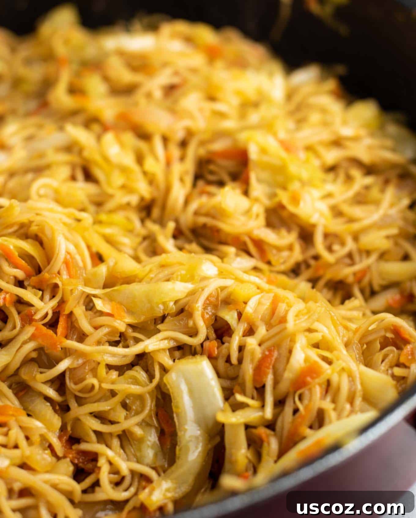 Savory Cabbage Stir Fry 4 cabbage and carrot with ramen noodles in a skillet before sauce is added