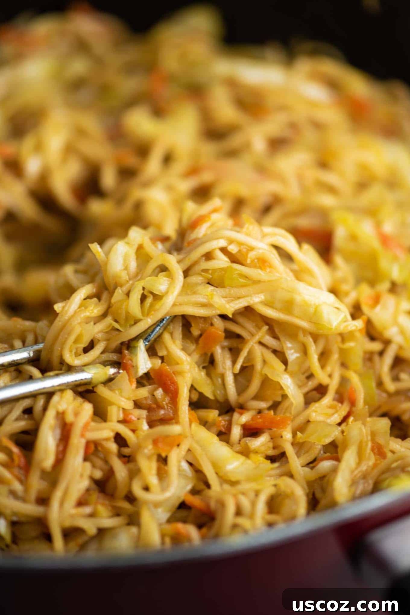 Savory Cabbage Stir Fry 5 ramen noodle cabbage stir fry in a red pan, before adding sauce