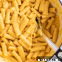 creamy pumpkin pasta sauce with rigatoni in a dutch oven