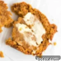 a slice of pumpkin bread from scratch smeared with melting butter