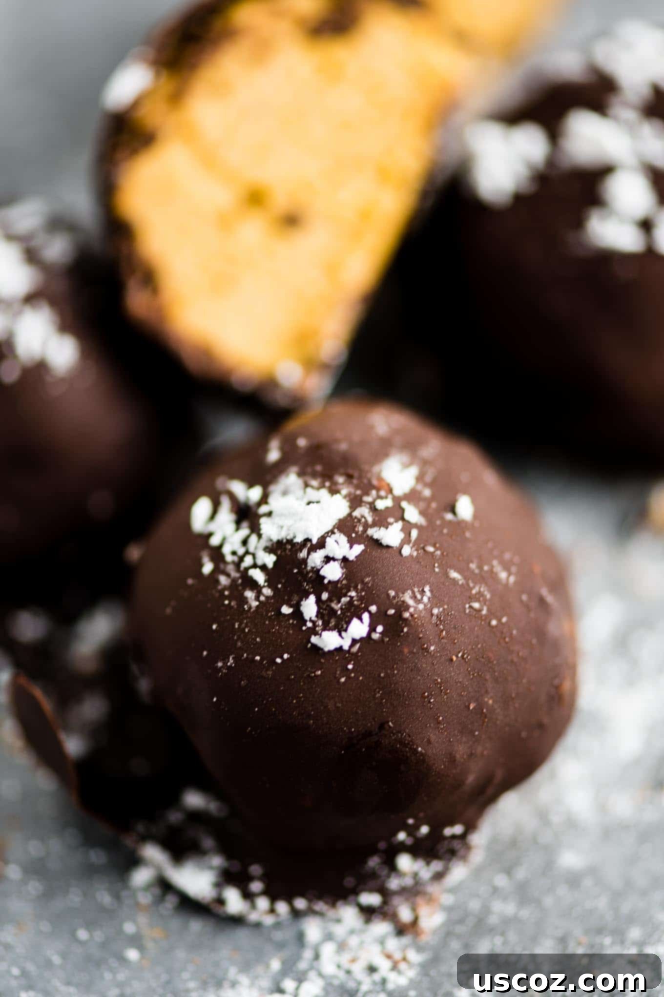No-Bake Pumpkin Cheesecake Delights 3 pumpkin cheesecake truffles sprinkled with powdered sugar
