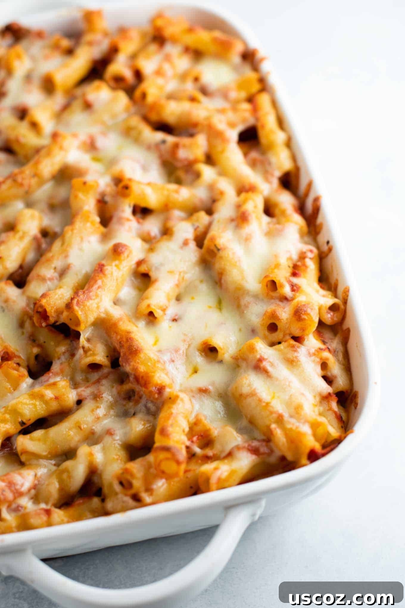 Ultimate Triple Cheese Baked Ziti 7 ziti in the pan before serving, showcasing its appealing golden top and cheesy texture