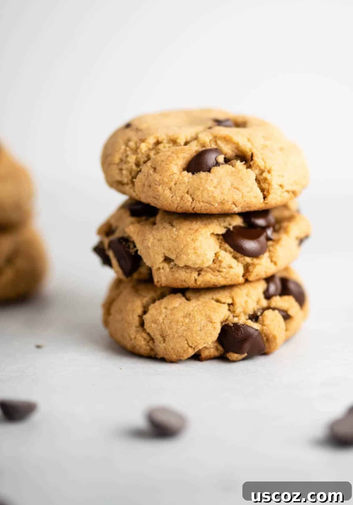 three vegan gluten free chocolate chip cookies stacked
