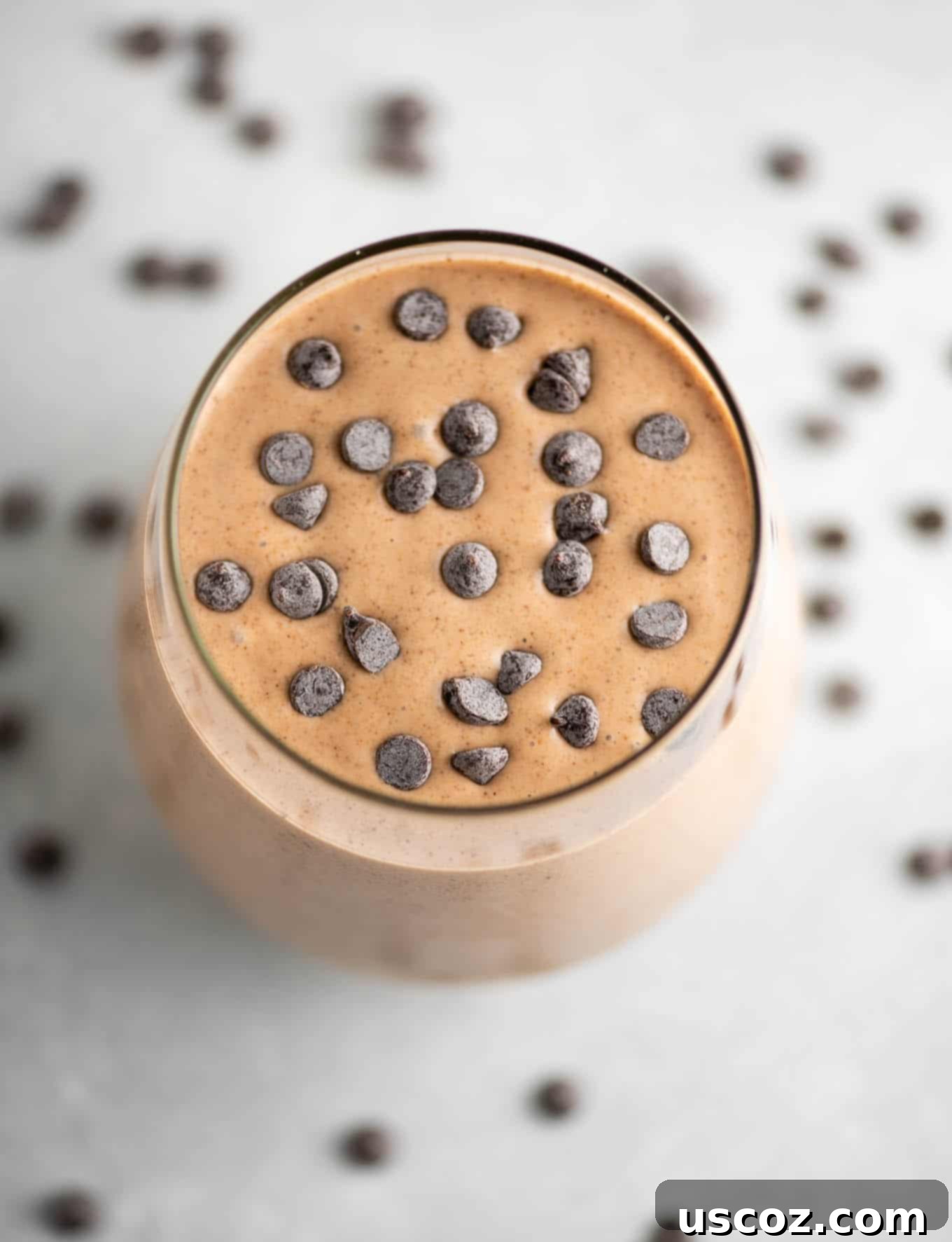 chocolate smoothie with chocolate chips on top from an overhead view