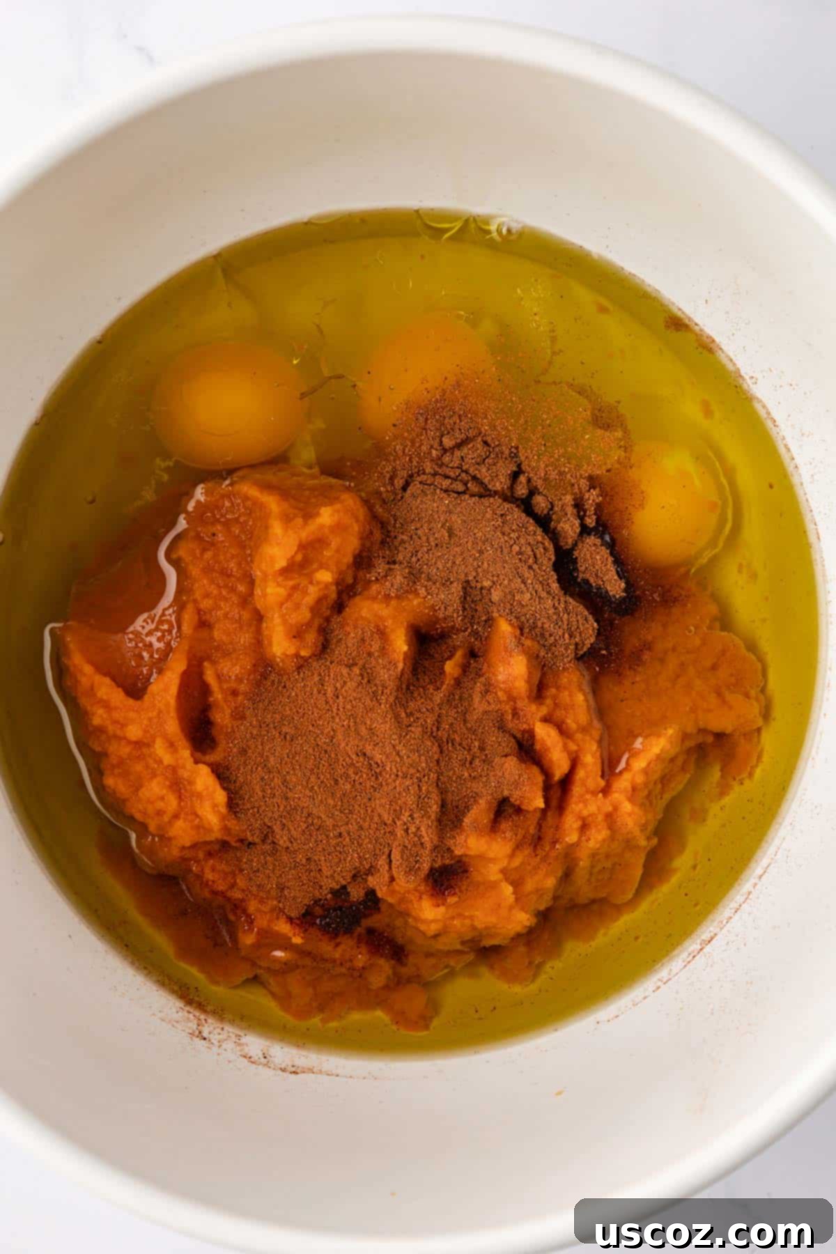 Effortless Cake Mix Pumpkin Bread 5 wet ingredients in a mixing bowl