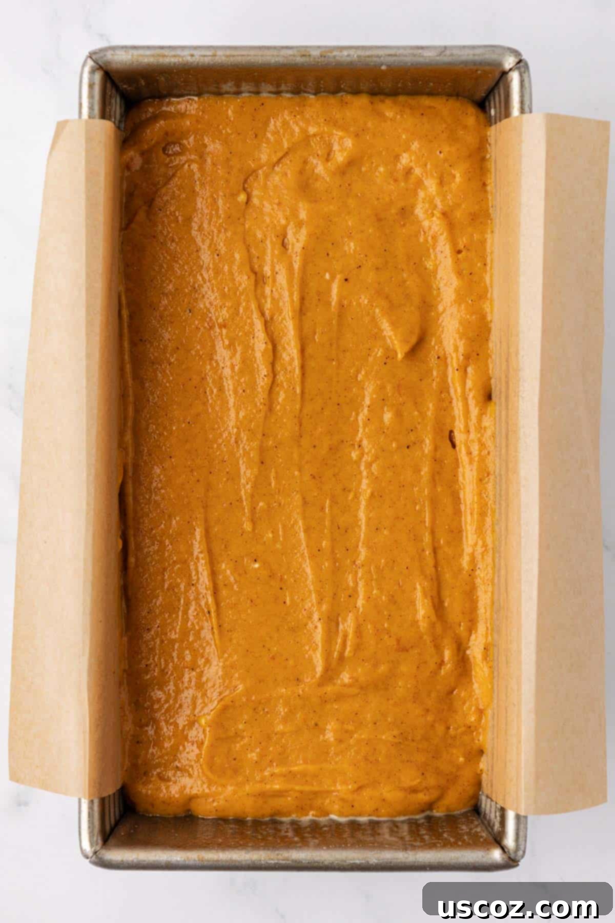 Effortless Cake Mix Pumpkin Bread 9 pumpkin bread batter in a loaf pan