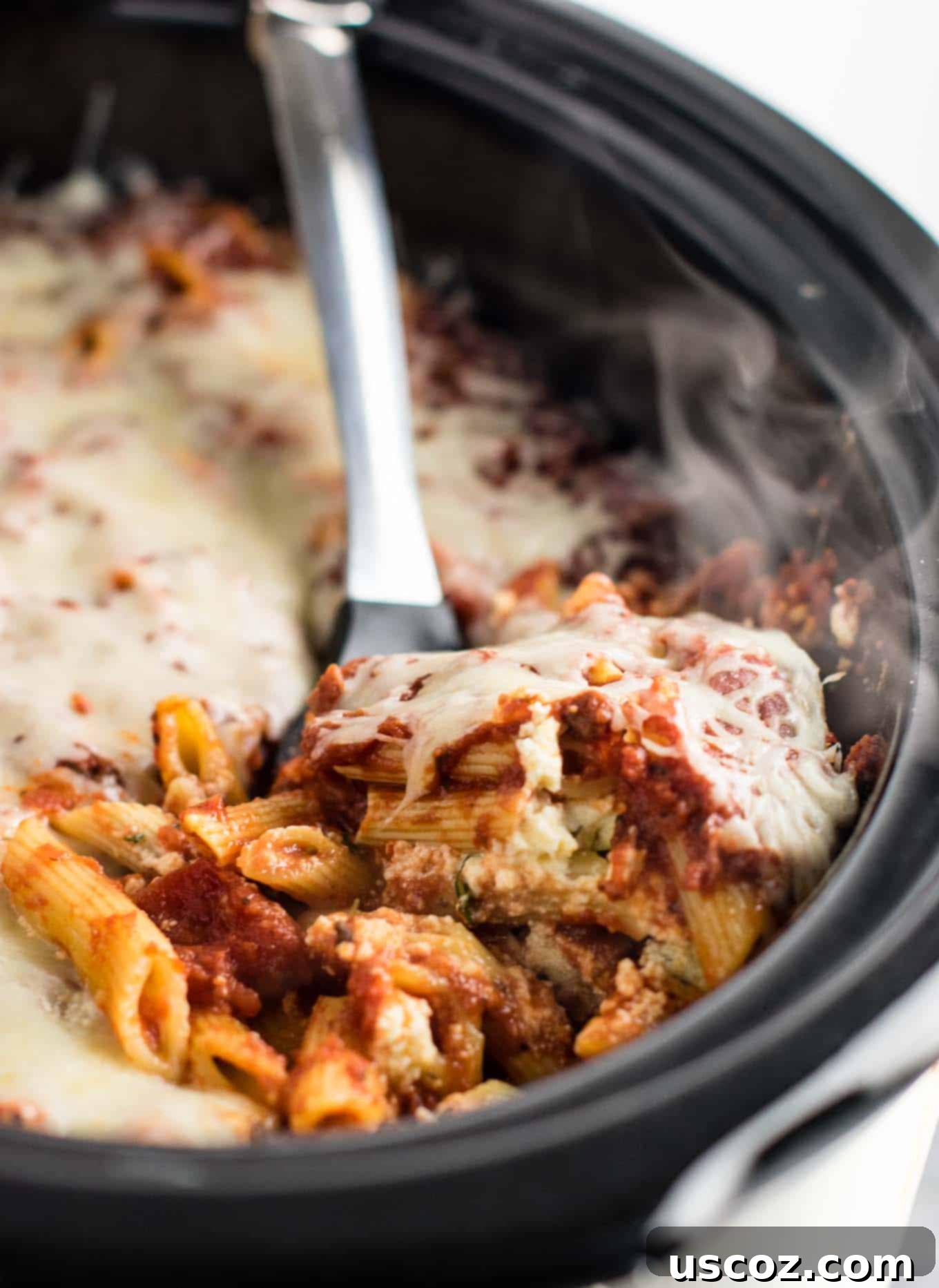 This Easy Crockpot Baked Ziti gets RAVE reviews. Everyone loves this when I make it! So simple to assemble and you don’t even have to cook the noodles first! #crockpotbakedziti #ziti #pasta #slowcooker