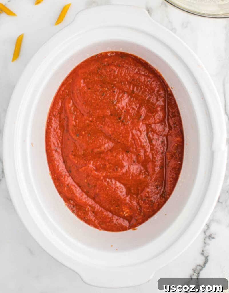another sauce layer added to the baked ziti