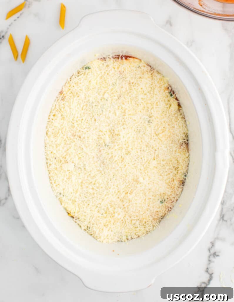 parmesan cheese spread out over the ricotta