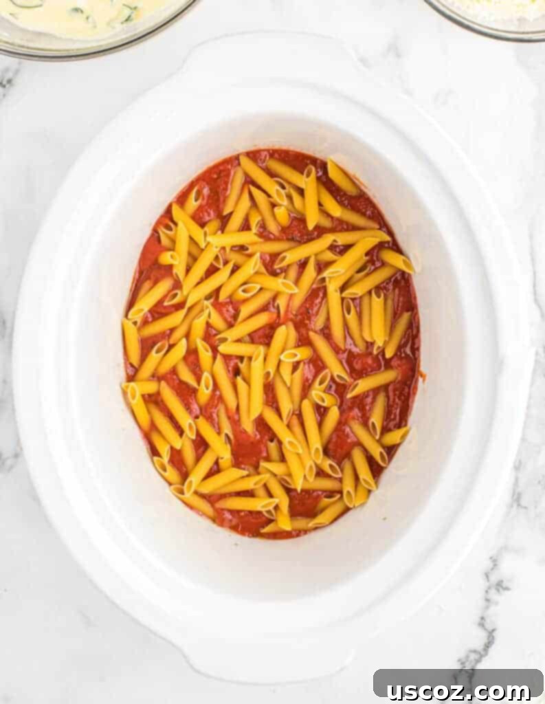 penne layer added to the slow cooker