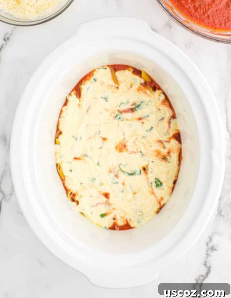 ricotta layer added to the slow cooker