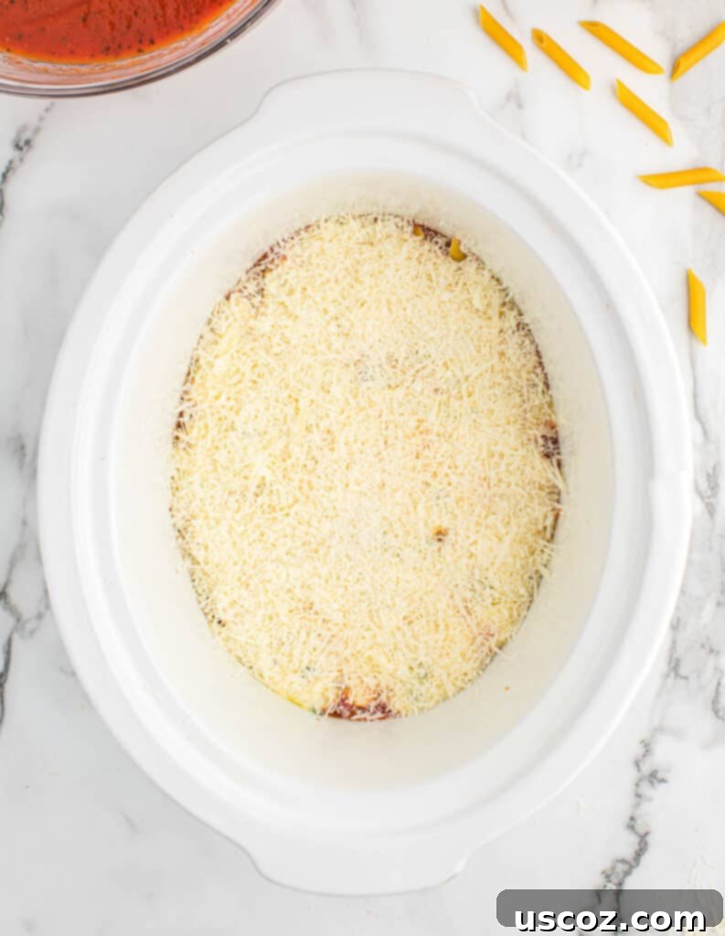 parmesan cheese layer added to the slow cooker