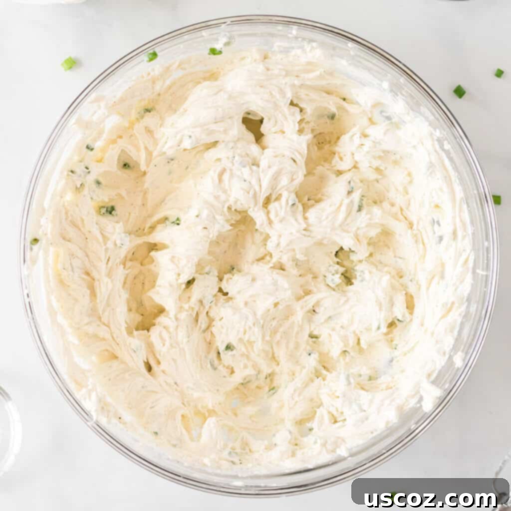 Party Perfect Cheese Ball 6 Creamy cheese ball filling after all ingredients have been thoroughly mixed together, showcasing a smooth and consistent texture.