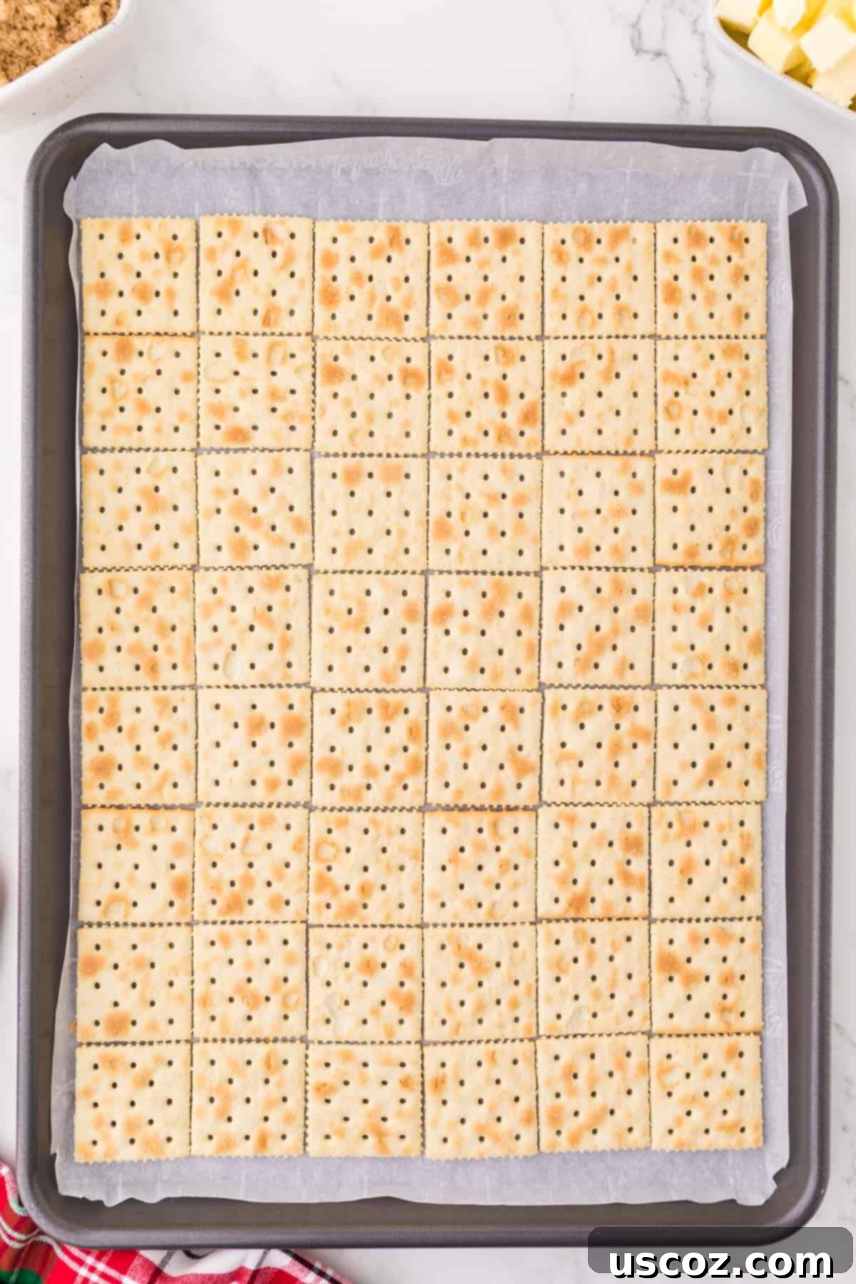 Christmas Cracker Toffee Recipe 6 saltine crackers lined on a baking sheet