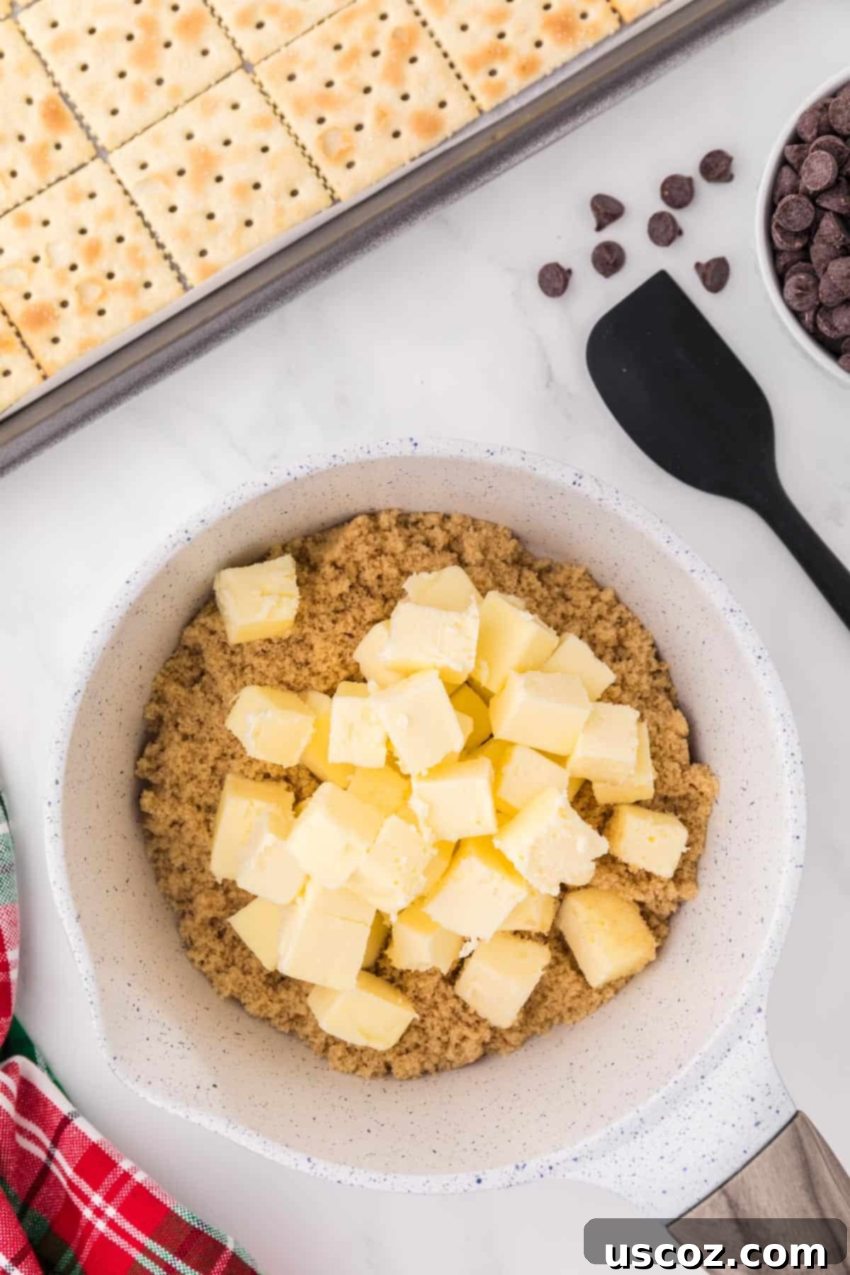 Christmas Cracker Toffee Recipe 7 butter and brown sugar in a sauce pan