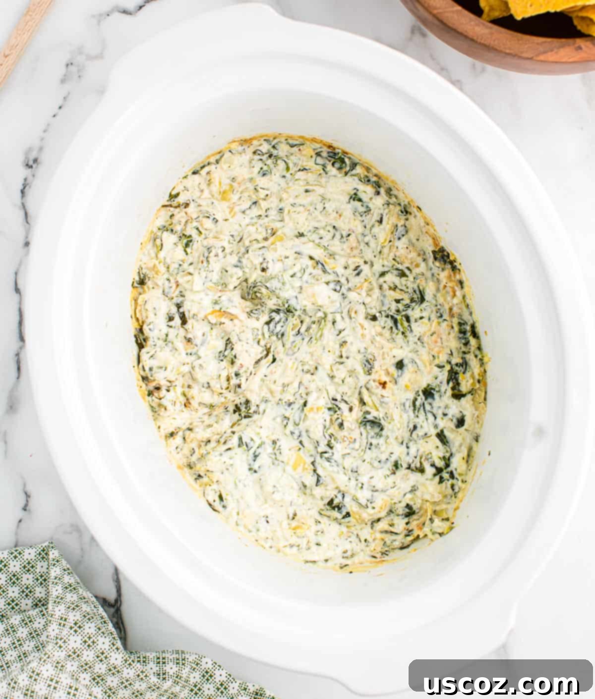 Creamy Slow Cooker Spinach Artichoke Dip 12 spinach artichoke dip in a slow cooker