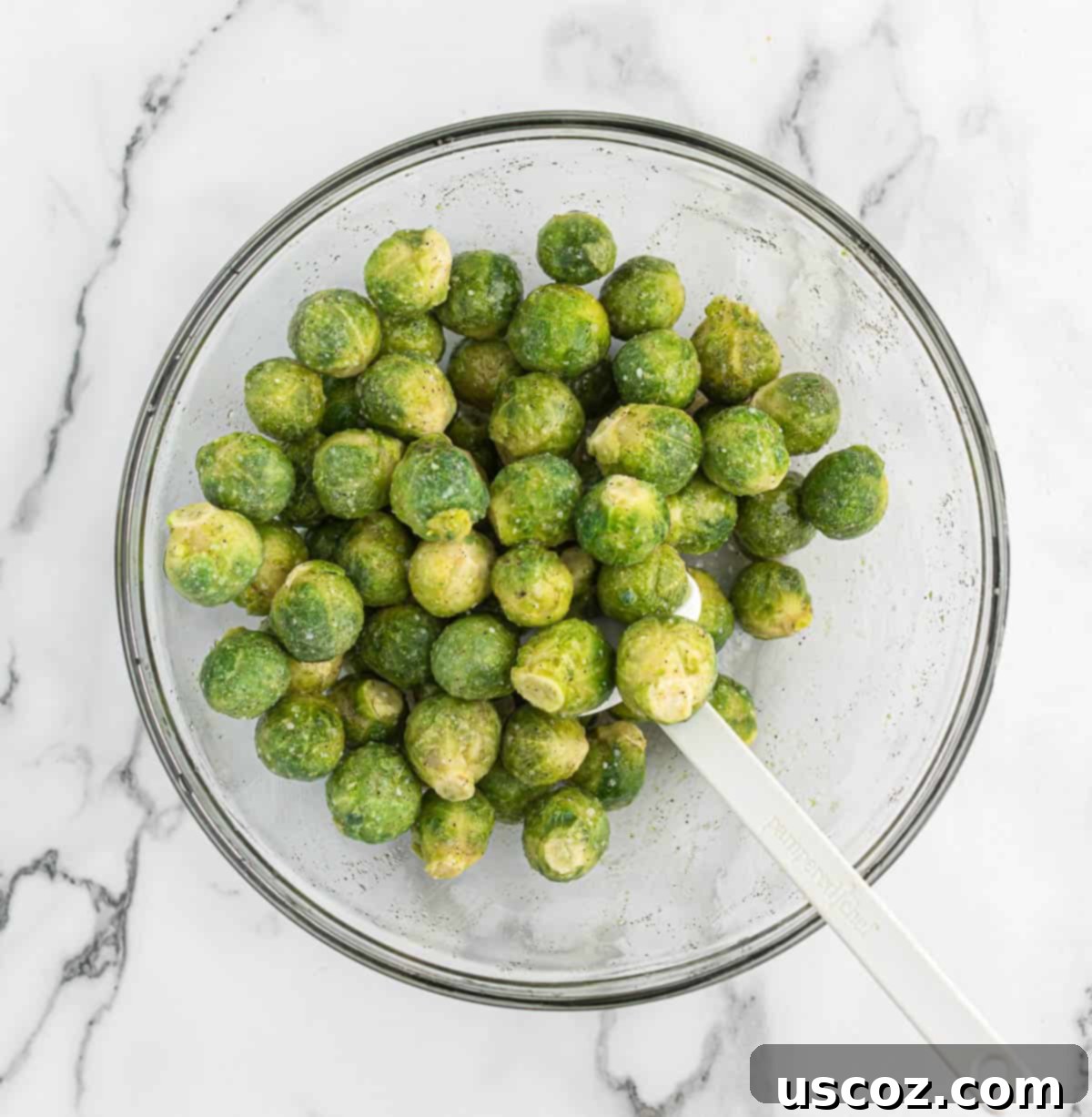 Crispy Roasted Frozen Brussels Sprouts 5 frozen brussel sprouts in a mixing bowl