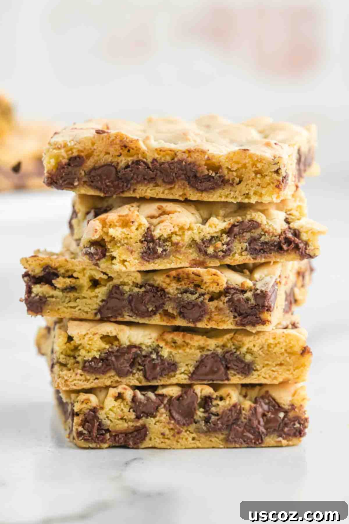 Cake Mix Cookie Squares 14 stacked cake mix cookie bars, showing their thick, appealing layers