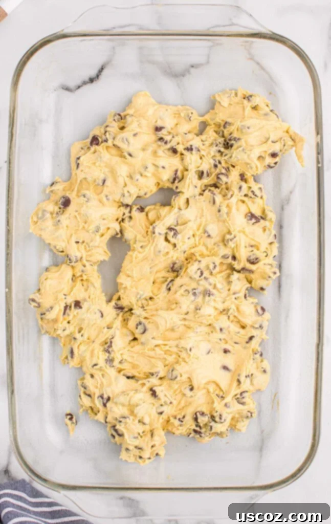 Cake Mix Cookie Squares 9 thick cake mix cookie bar batter placed in a 9x13 baking dish