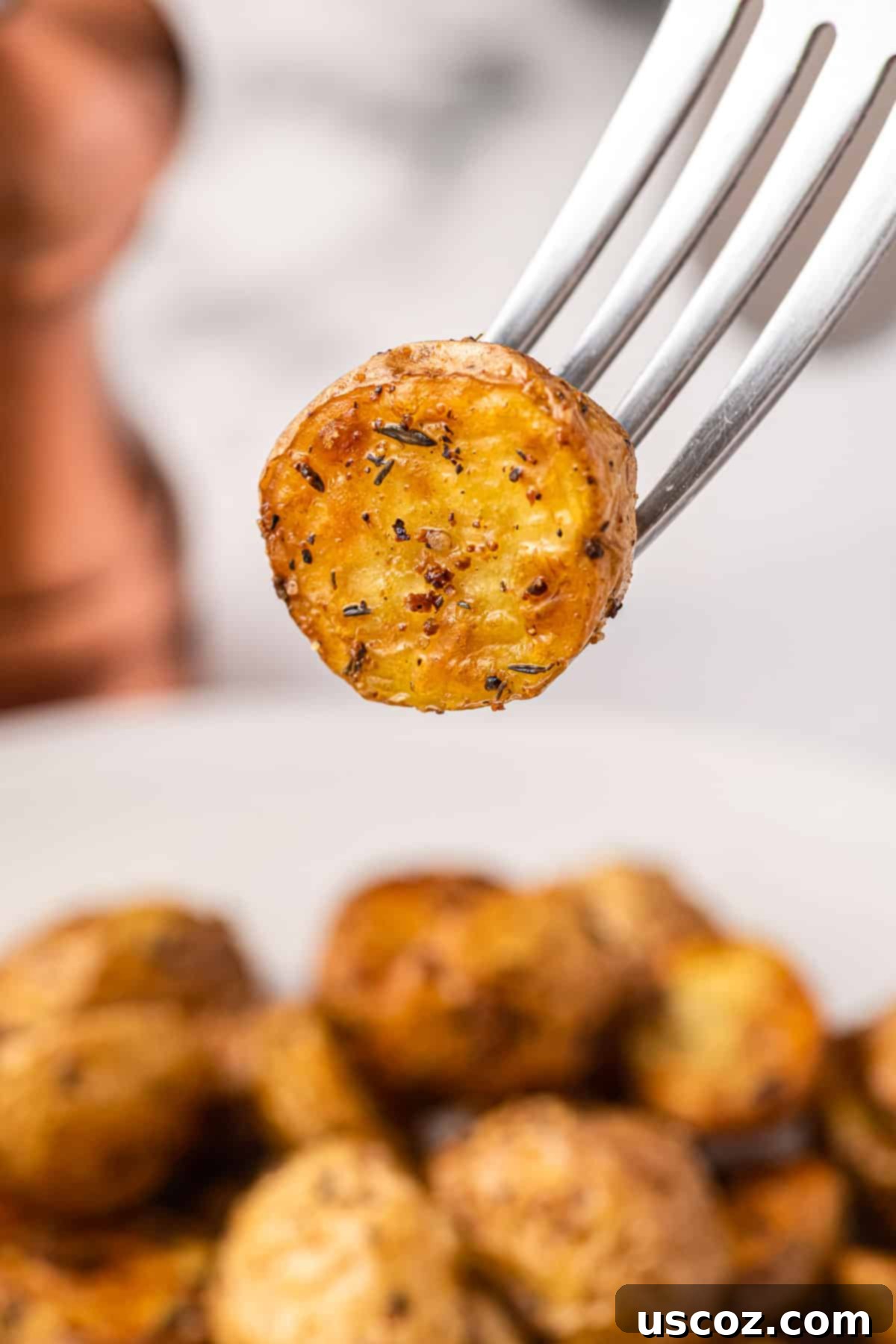 Crispy Golden Air Fryer Baby Potatoes 15 a fork holding a potato bite