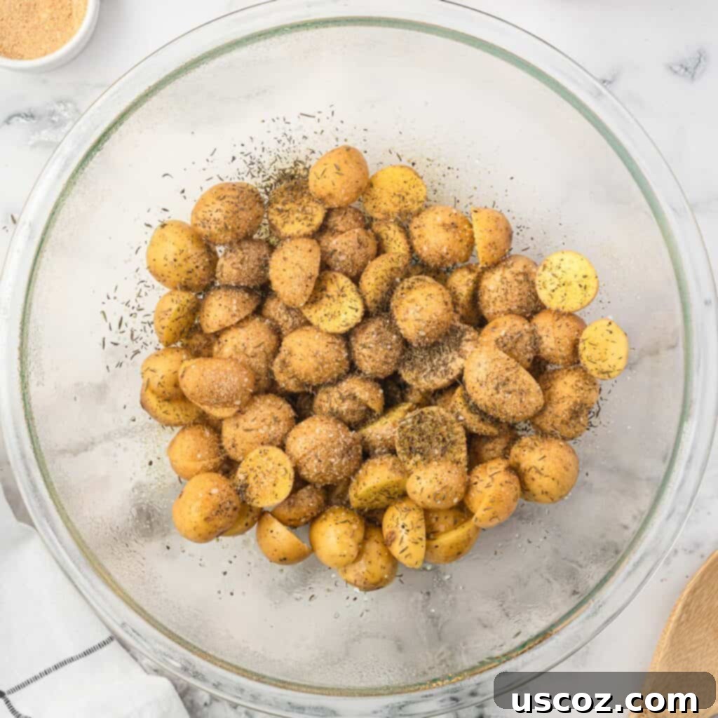 Crispy Golden Air Fryer Baby Potatoes 7 adding spices to the potatoes