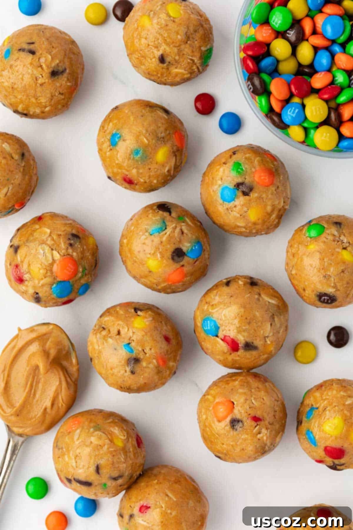 Monster Cookie Energy Bites 12 A close-up on a few monster cookie bites artfully placed, emphasizing their inviting textures and colors.