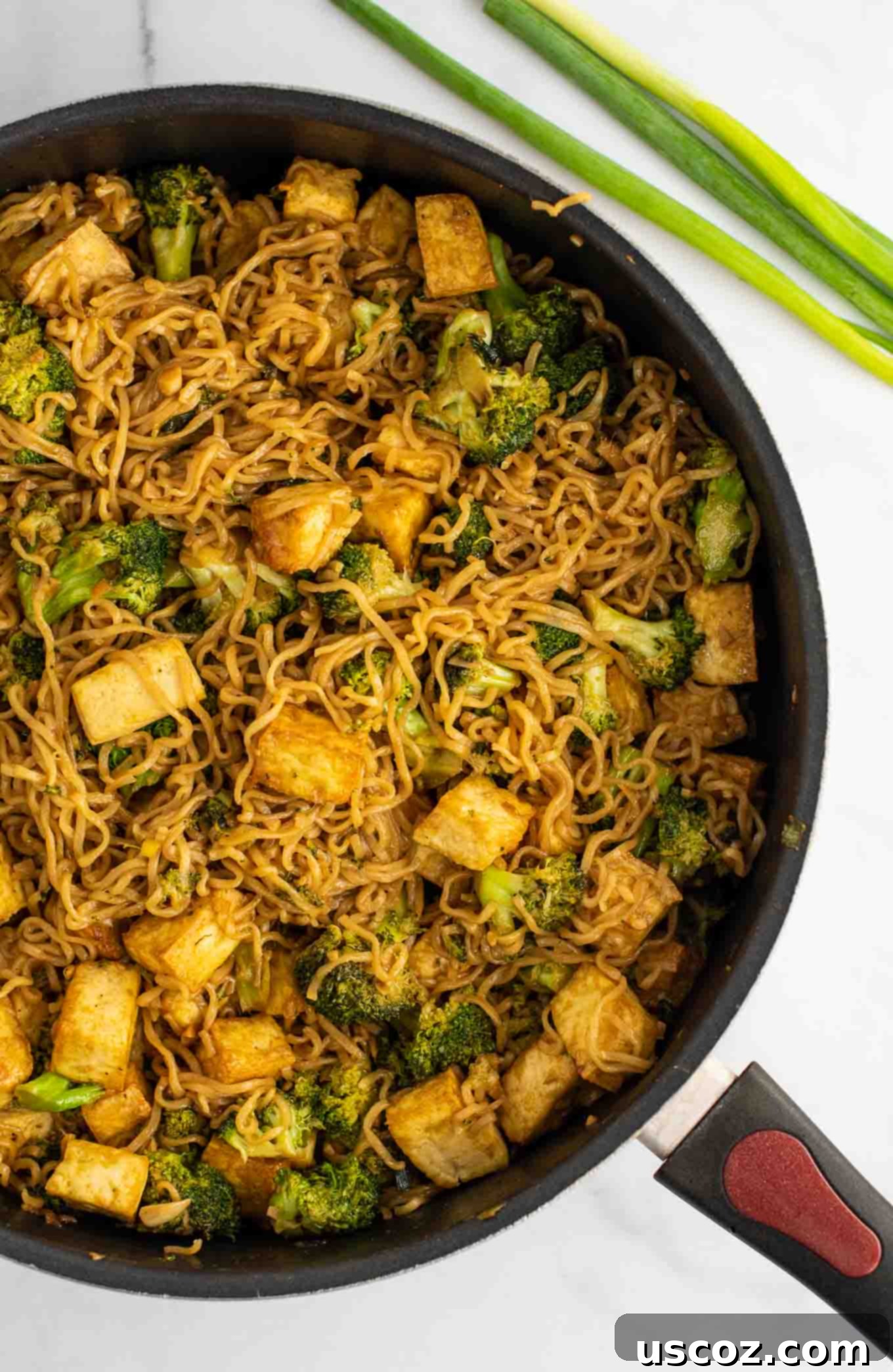 Savory Broccoli Tofu Ramen 3 broccoli tofu ramen noodles in a skillet from an overhead view
