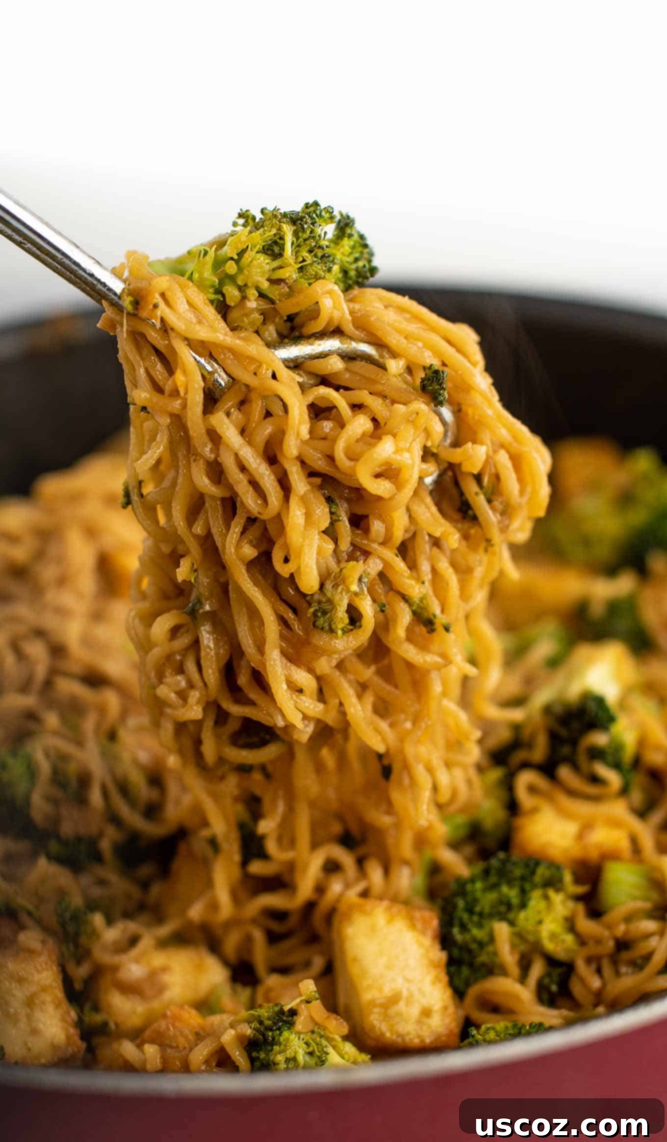 Savory Broccoli Tofu Ramen 10 tongs grabbing the ramen noodles