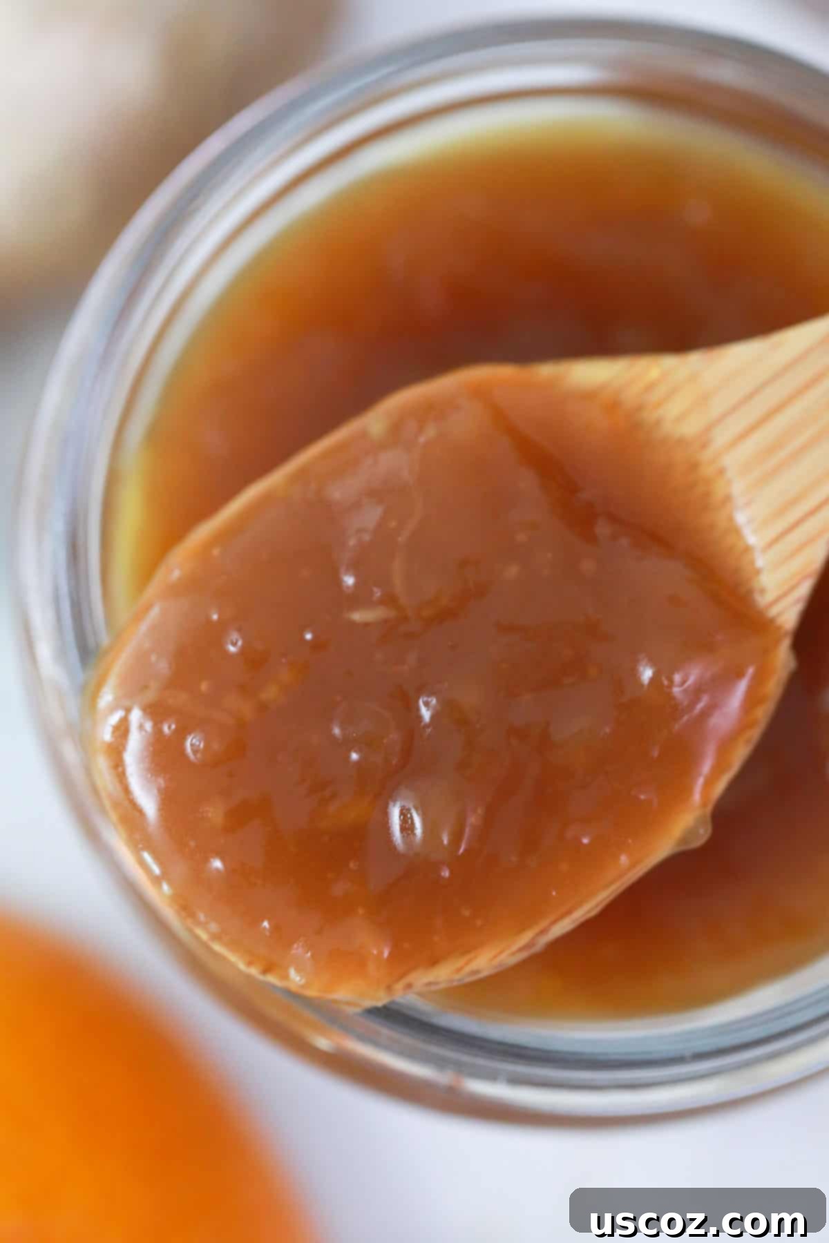 Zesty Orange Sauce 4 chinese orange sauce on a wooden spoon