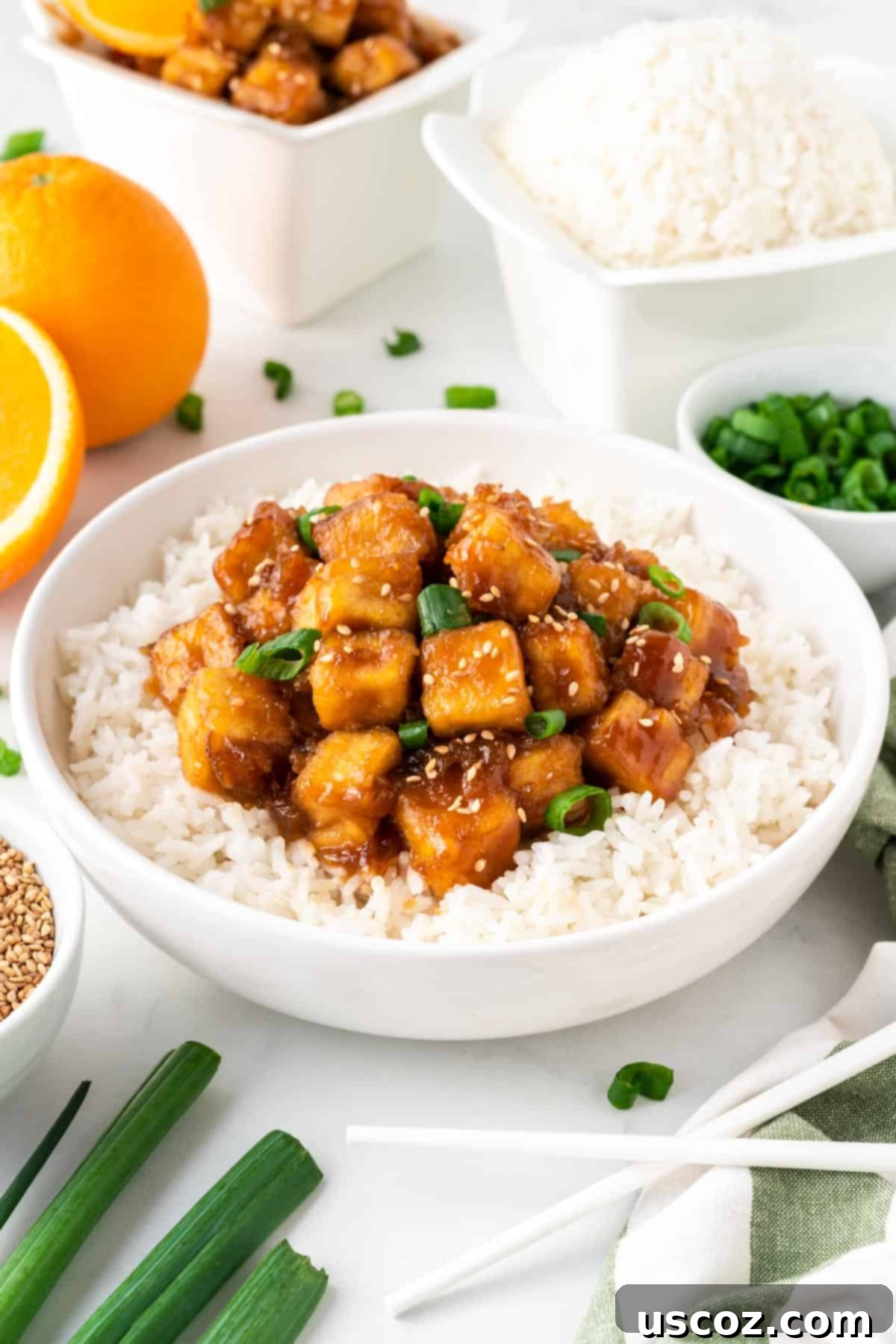 Zesty Orange Tofu 2 orange tofu over rice in a bowl