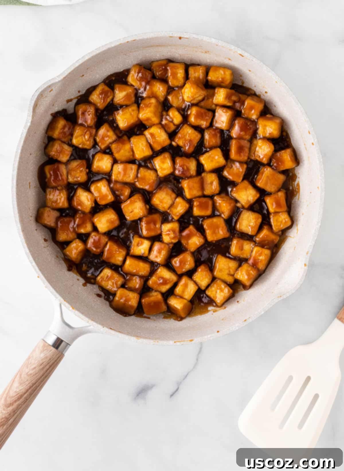 Zesty Orange Tofu 12 adding the orange sauce to the skillet