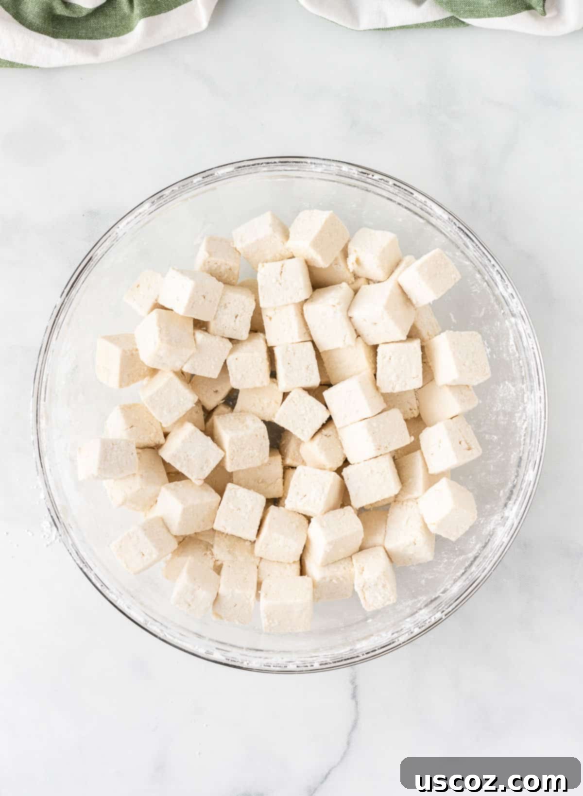 Zesty Orange Tofu 8 corn starch coated cubed tofu in a bowl