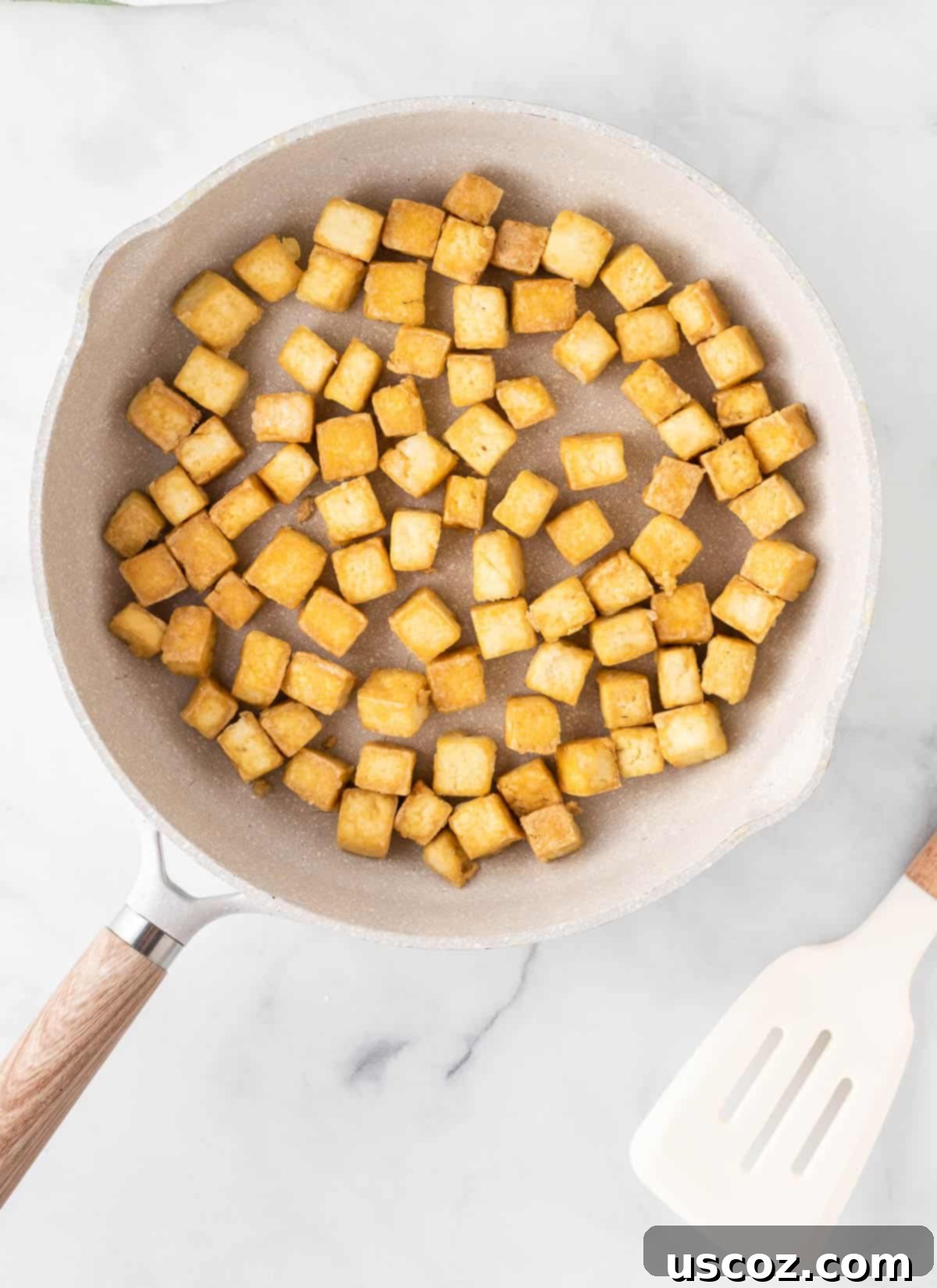 Zesty Orange Tofu 10 crispy golden tofu cubes in the skillet