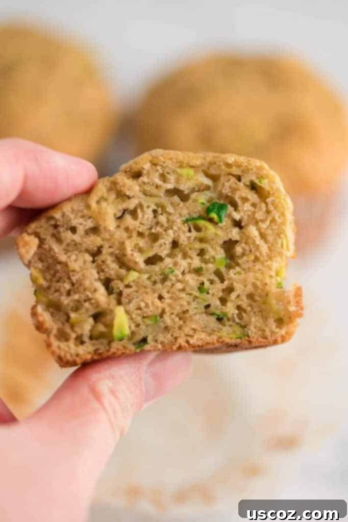 Sweet Zucchini Treats 5 Half of a zucchini muffin showing its moist, tender inside.