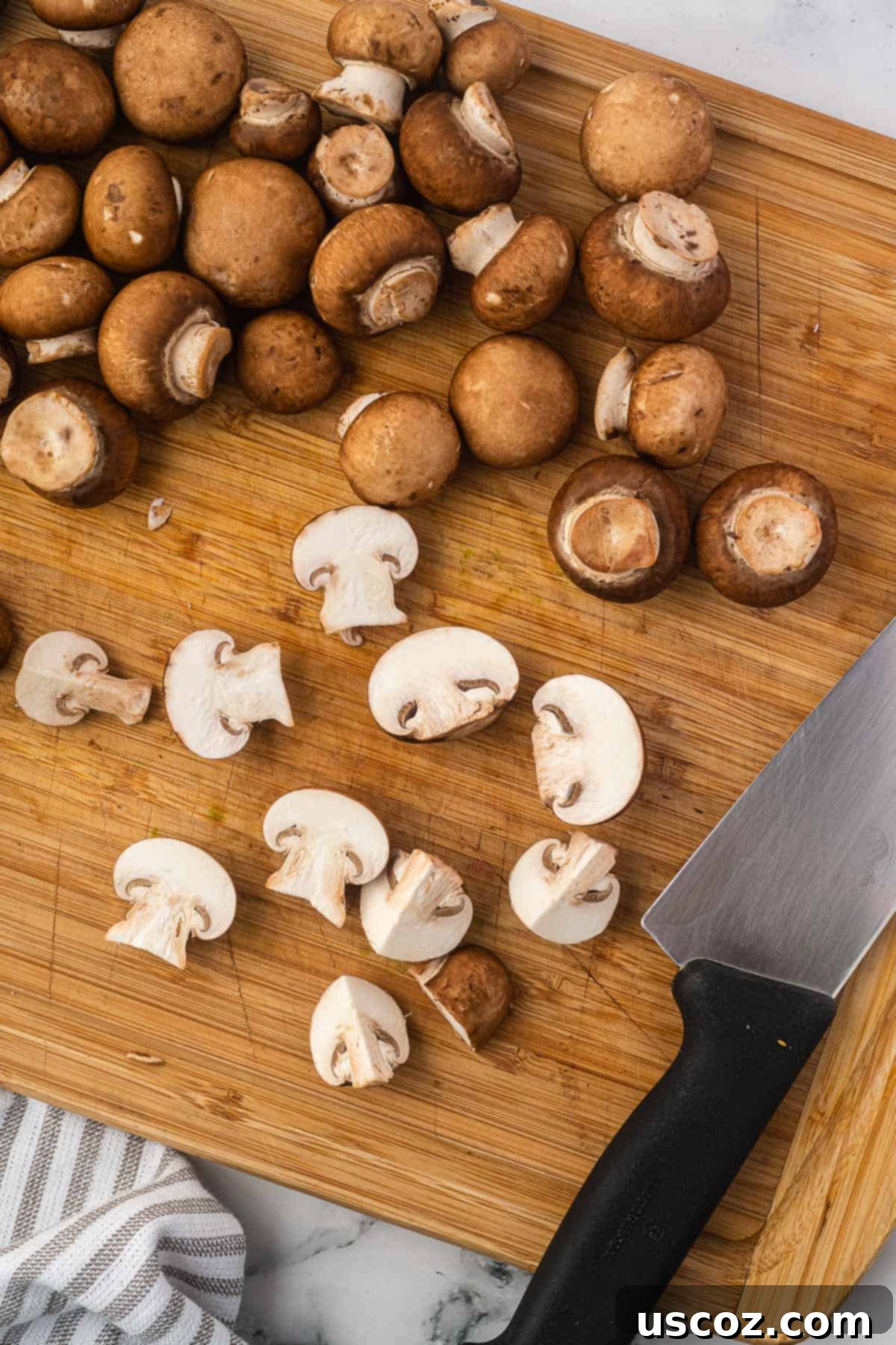 Crispy Air Fryer Mushrooms 5 cutting the mushrooms on a cutting board