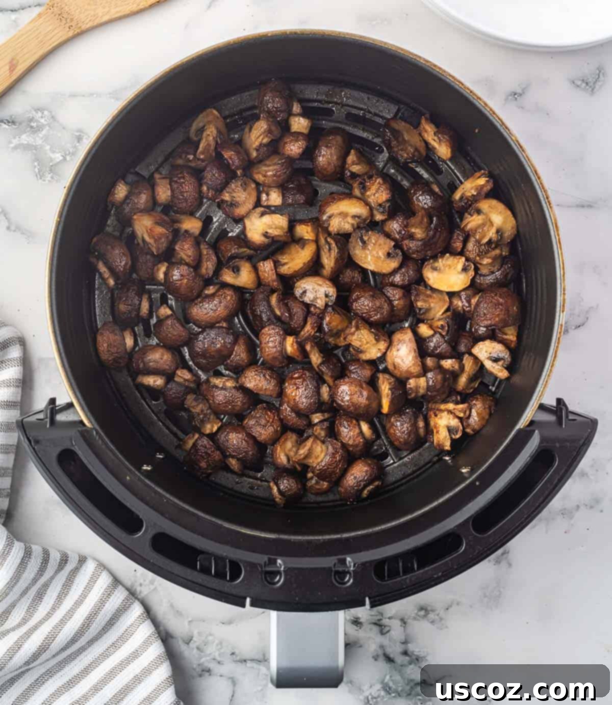 Crispy Air Fryer Mushrooms 9 air fried mushrooms in the air fryer basket