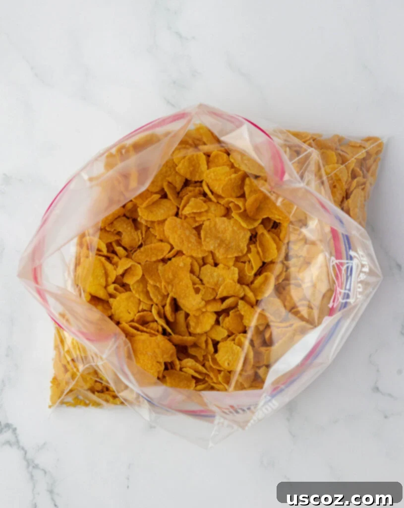 Crispy Cheesy Potato Casserole 11 Dry corn flakes measured and placed inside a resealable plastic bag, ready for crushing.